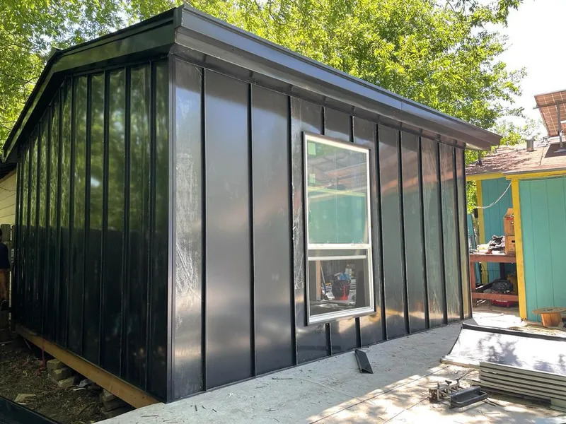 Black standing seam metal wall panels for Roof Inspection in Busti